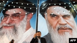 Iranian President Mahmud Ahmadinejad speaks in front of looming posters of Supreme Leader Ayatollah Ali Khamenei (left) and revolutionary leader Ayatollah Ruhollah Khomeini in Tehran. (file photo)