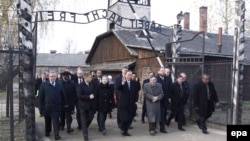 UN Secretary-General Ban Ki-moon (center) and his wife on a visit to the former German Nazi Concentration Camp KL-Auschwitz I, in Oswiecim, on November 18