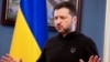 Ukrainian President Volodymyr Zelenskyy talks to reporters in Kyiv on February 19.